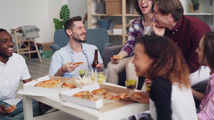 Friends Enjoying Pizza and Drinks at Home