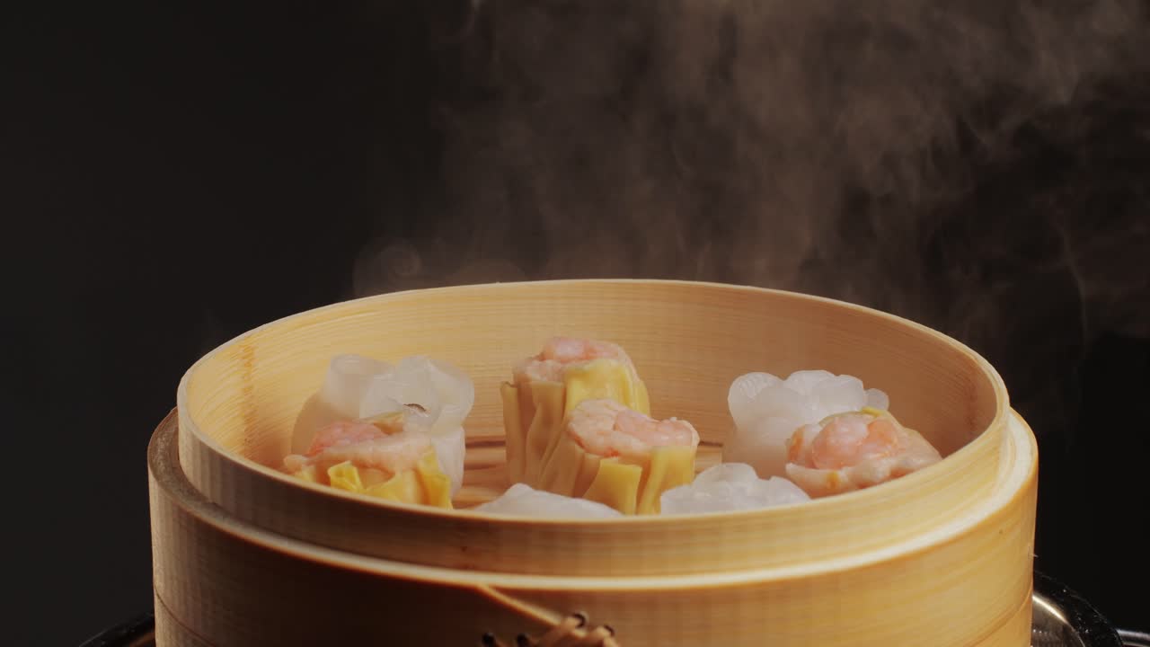 Various of dim sum on wooden steamer close-up macro. Steaming Technique. Chinese dessert food. Dimsum with shrimps, fish and meat. Dish in a cafe. Homade. Delivery