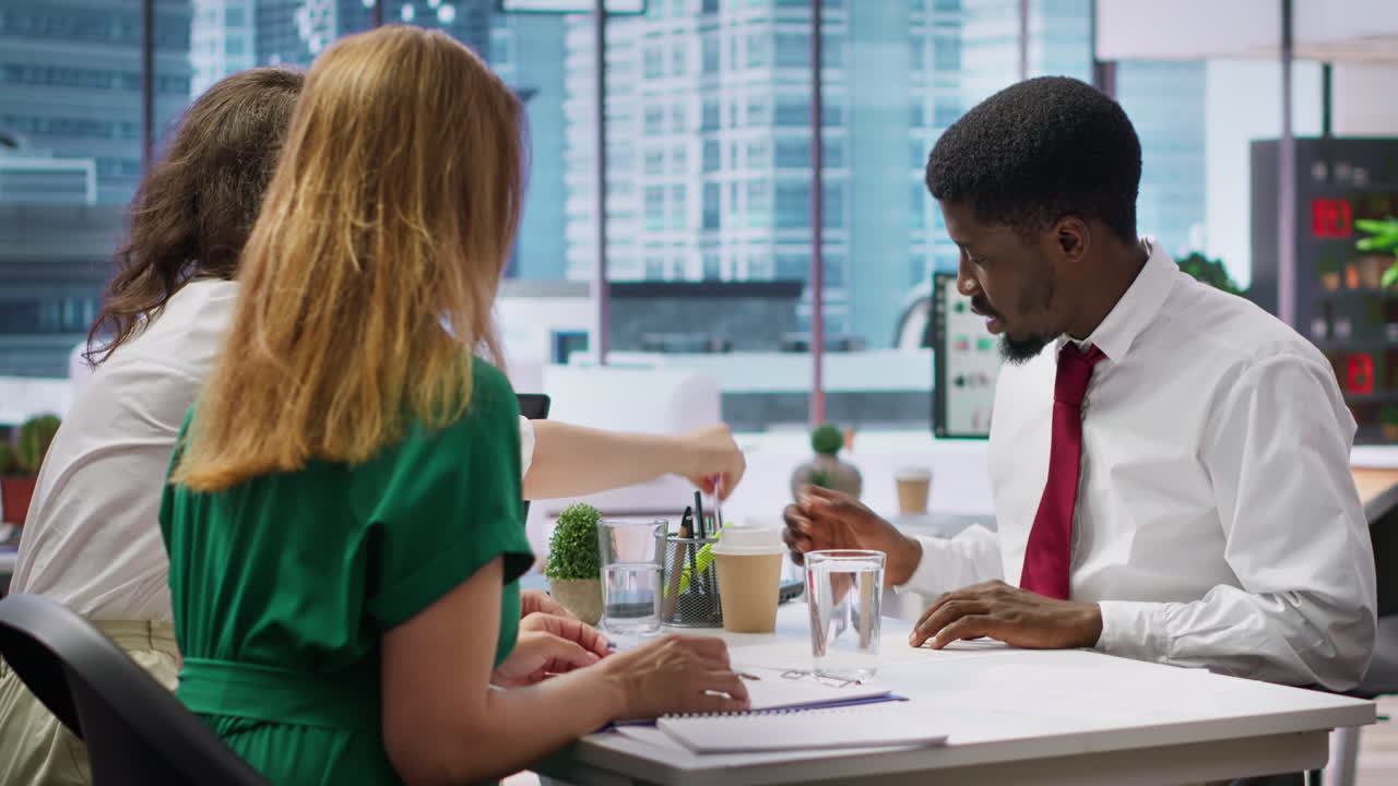 Job seeker at interview writing his name on application form