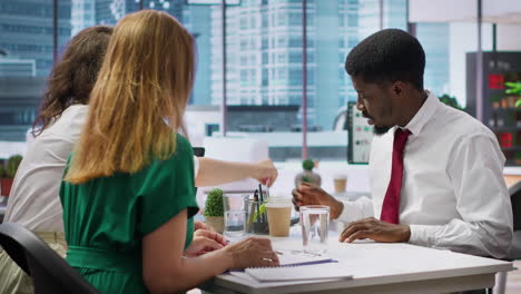 job seeker at interview writing his name on application form