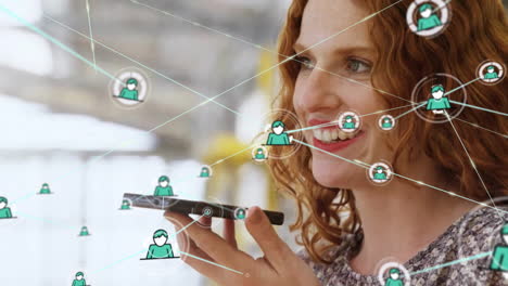 Animation-of-network-of-connections-over-caucasian-woman-talking-on-smartphone