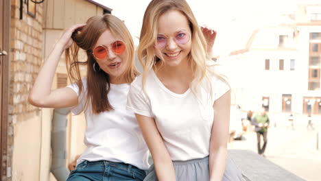 two happy women friends enjoying the city