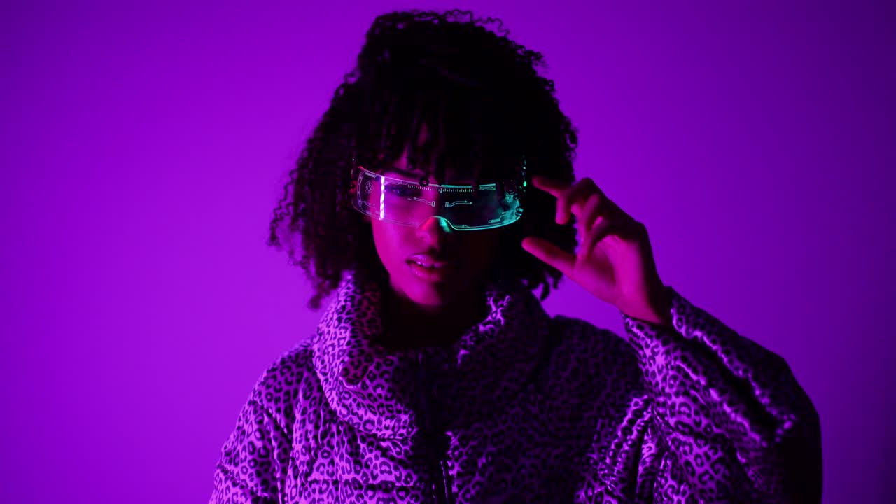 Woman wearing cyberpunk glasses in neon light