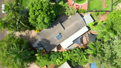 rotating aerial drone shot over a residential home with a tile roof