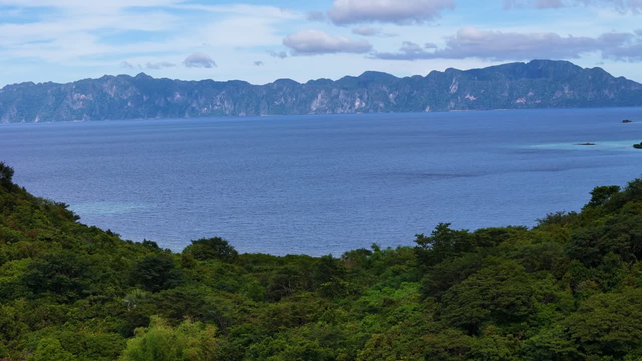 Tropical Island Landscape with Lush Forest and Azure Ocean