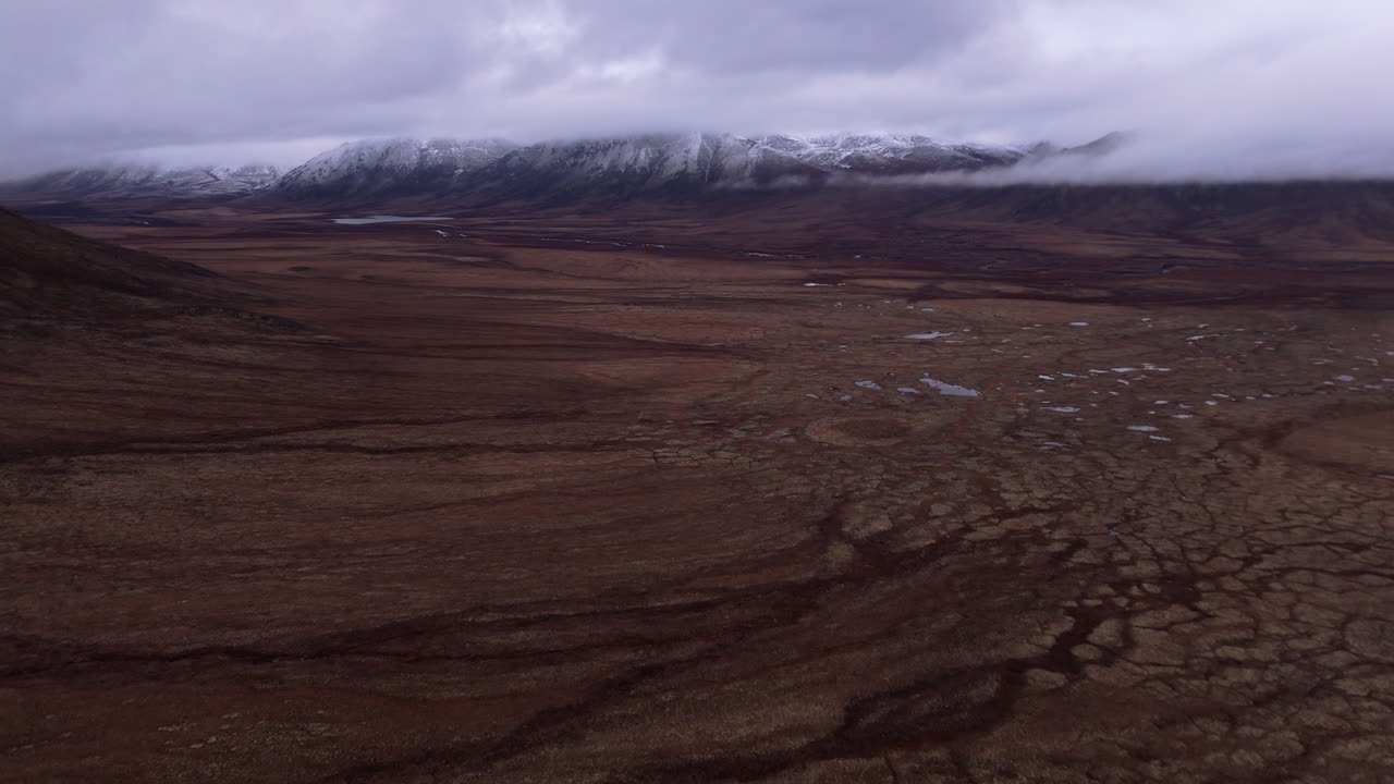 Ogilvie Mountain Range During Fall In Yukon, Canada - Aerial Drone Shot