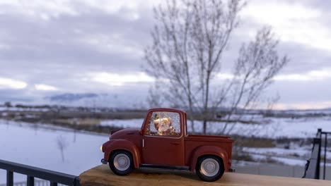 santa claus in a red, toy truck as the sunset turns to sundown - motion time lapse cloudscape