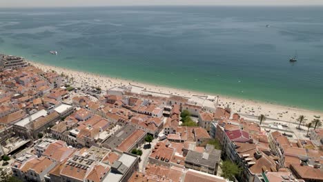 sesimbra beach in summer season, portugal. aerial orbit