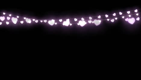 Digital-animation-of-purple-decorative-heart-shaped-fairy-lights-hanging-against-black-background