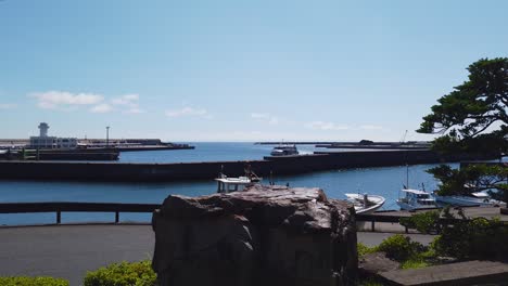 yakushima port at miyanoura town, panning establishing shot, japan