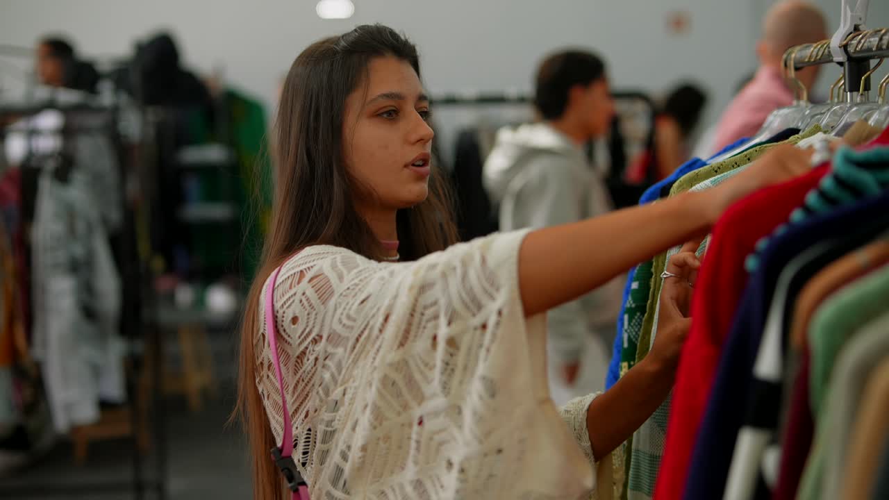 Woman shopping for clothes at a clothing rack