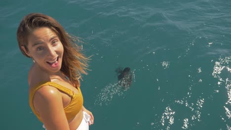 Beautiful-Girl-Watching-Wrasse-Fish-Swimming-At-The-Coral-Sea-In-Great-Barrier-Reef