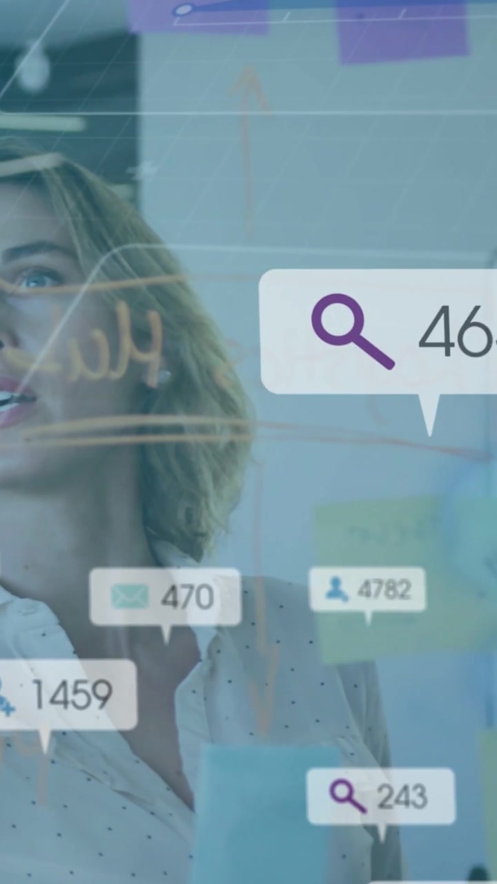 Vertical video: Manager scanning glass board, tracking moving callouts updating for analytics check