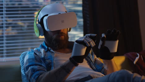 man wearing vr headset and vr gloves