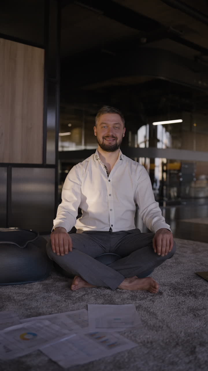 Businessman Meditating in Modern Office