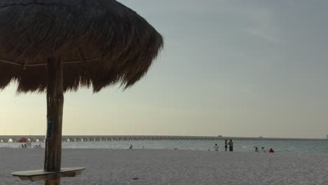 Palm-roof-umbrellas-at-Puerto-Progreso-beautiful-beach-in-Yucatan,-Mexico