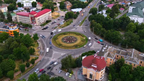 4k aerial view timelapse of roundabout road with circular cars in small european city