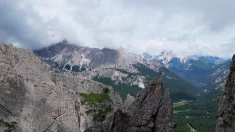 dolomites, italy - a breathtaking view of the towers of mordor, nearly touching the clouds - drone flying forward