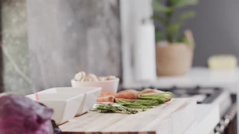 Close-up-of-fresh-vegetables-on-countertop-in-kitchen-,-slow-motion