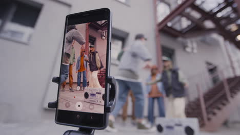 young people dancing on the street