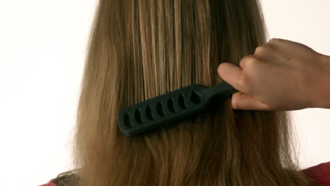 Pretty-blonde-brushing-her-hair