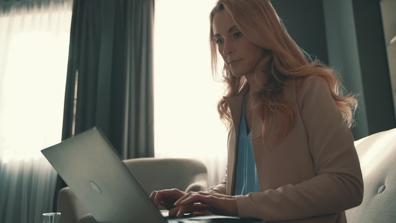 Woman Using A Laptop, Typing With The Keyboard