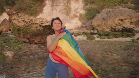Proud Man at the Beach with Pride Flag