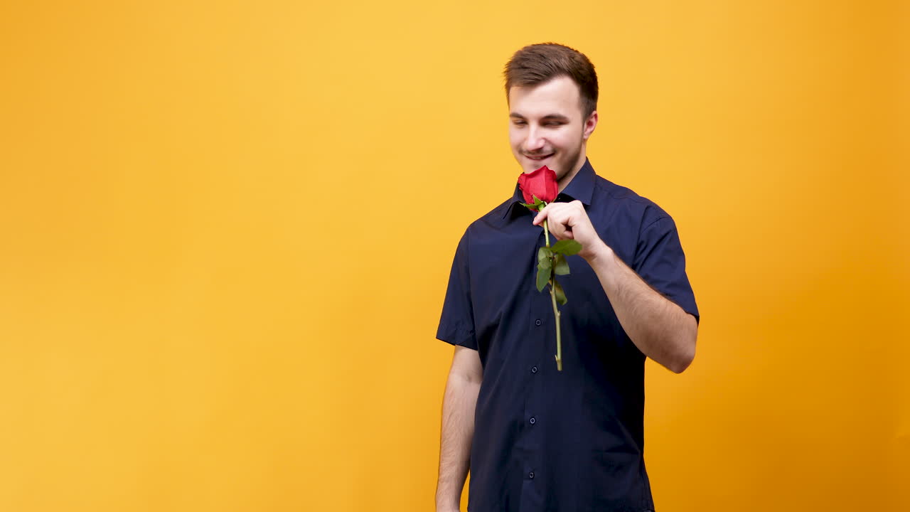 Man holding a red rose
