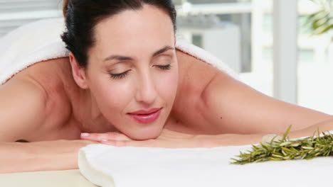 smiling woman getting an aromatherapy treatment