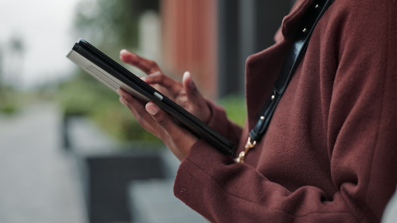 Woman Using Tablet in the City