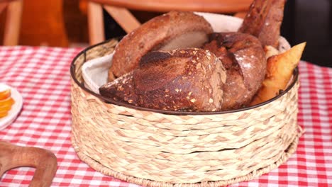 assortment of bread in a wicker basket