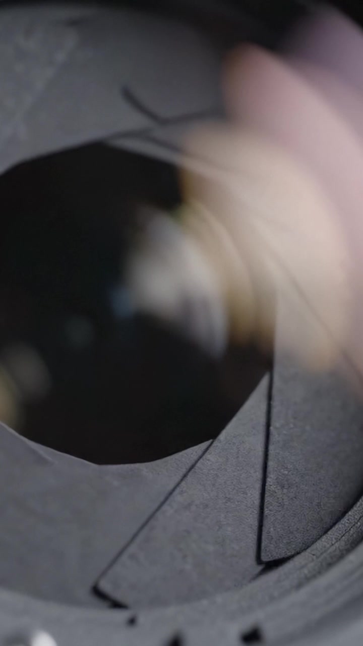Intricate Mechanism of a Camera Lens: Close-up View of Aperture Blades and Optical Glass Elements Captured in Detail