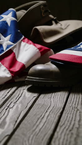 american flag and boots on wooden table