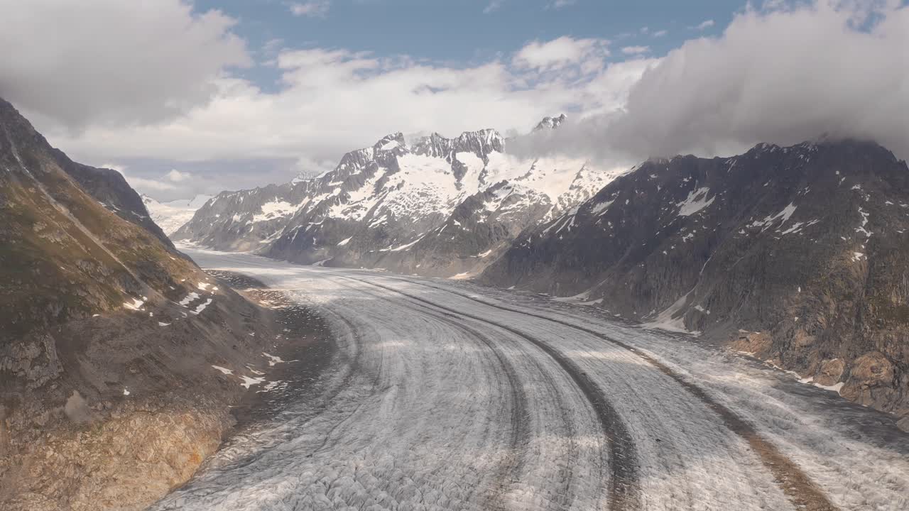 Glacier moving through Norwegian landscape, showcasing mountainous terrain and ice formations