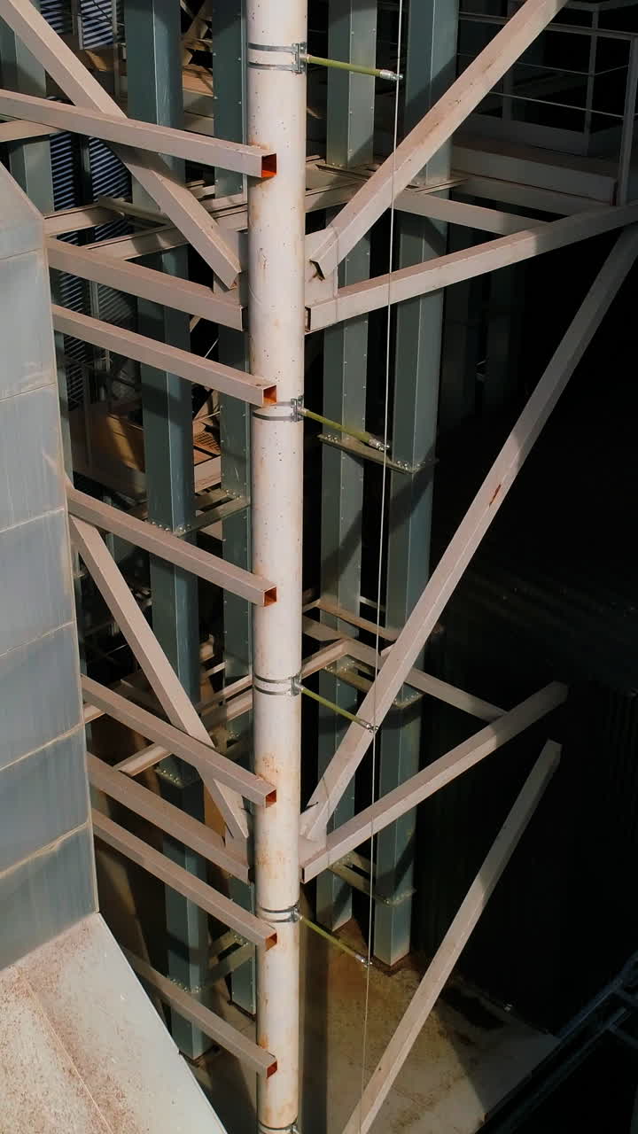 Aerial top view of Grain Elevator. Metal elevator in agriculture zone. Vertical video