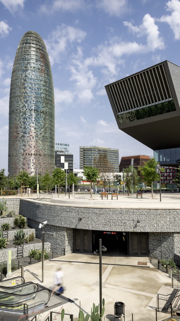 Timelapse of Glories Metro Station In Barcelona and skyline in vertical