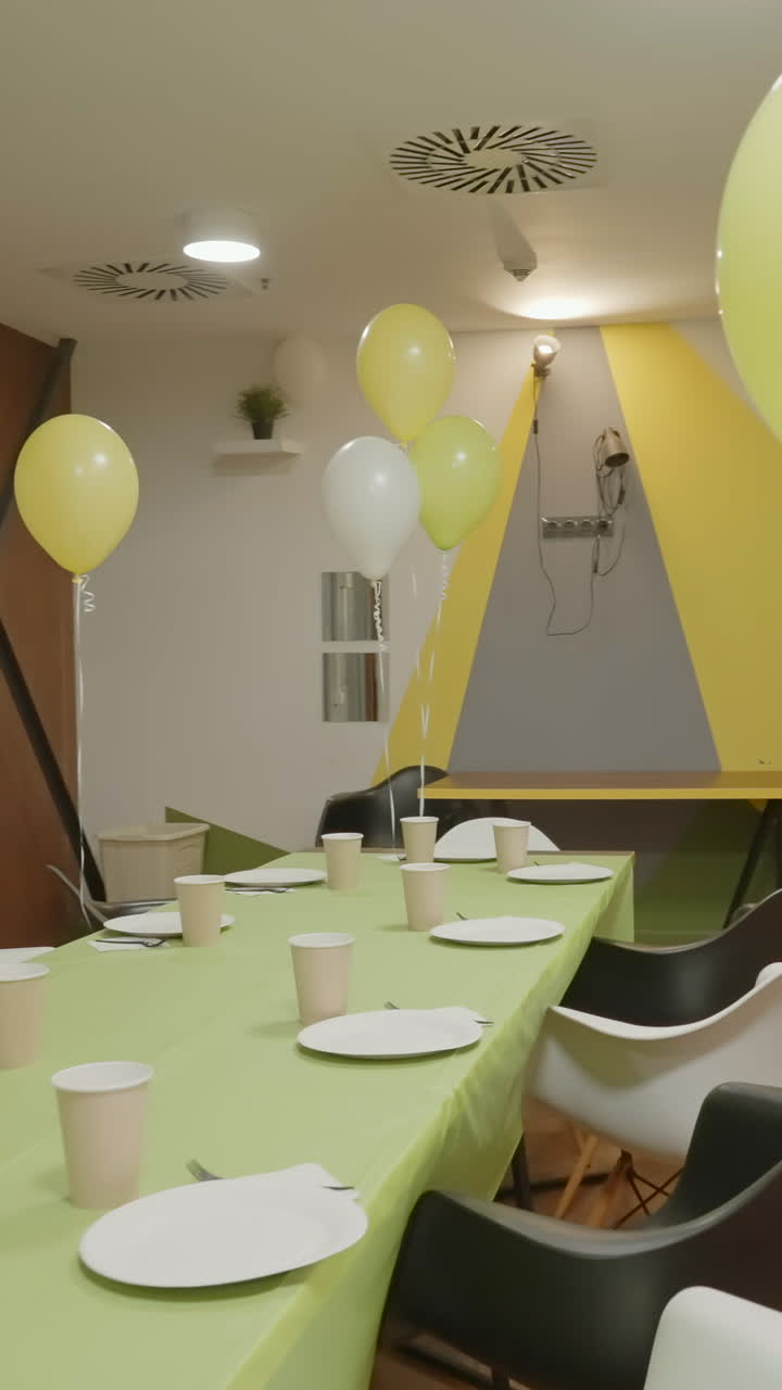 Party room with balloons and table setting