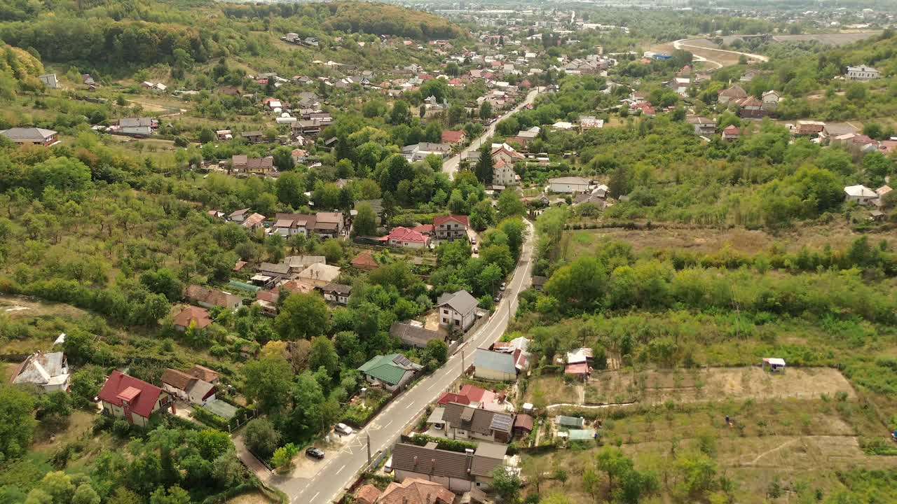 Smooth Aerial View Above a Small and Quiet Village in a Forest Near the City 4k 60fps