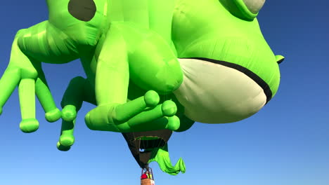 frog balloon lifting off, hot air balloon