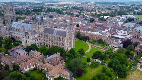 aerial view of ely cathedral with scenic urban cityscape in england, drone tracking shot