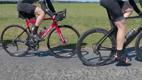 the road blurs as racing cyclists compete at speed in the countryside - north canterbury