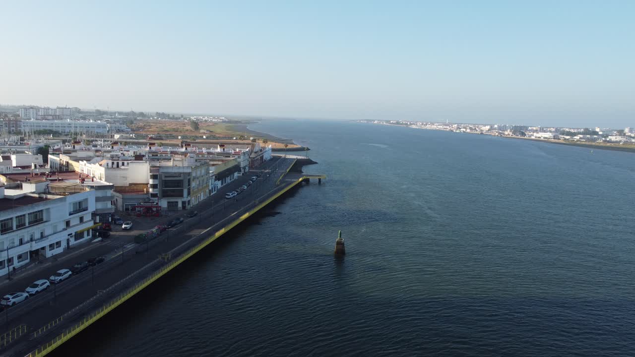 Drone shot of Rio Guadiana with Ayamonte in Spain and Vila Real de Santo Antonio in Portugal in the background