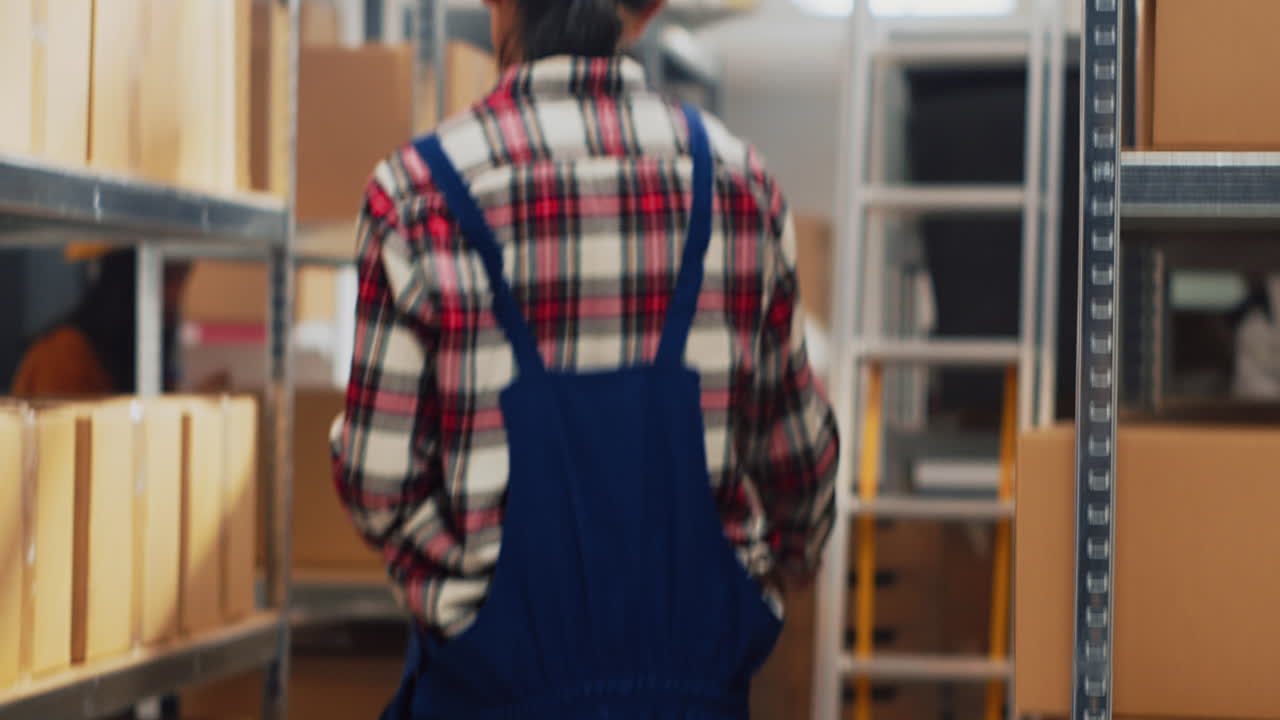 Warehouse Employees Handling Boxes and Inventory