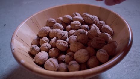 Dried walnuts in a wooden bowl-1