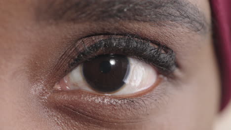 close-up-black-woman-eye-blinking-looking-at-camera-pensive-contemplative