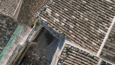 aerial view of modica alta val di noto sicily old baroque cliff town south with collapsed roofs italy