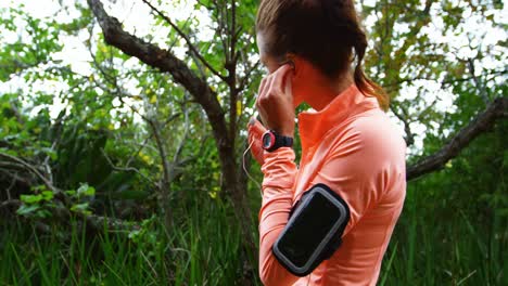 woman using earphones