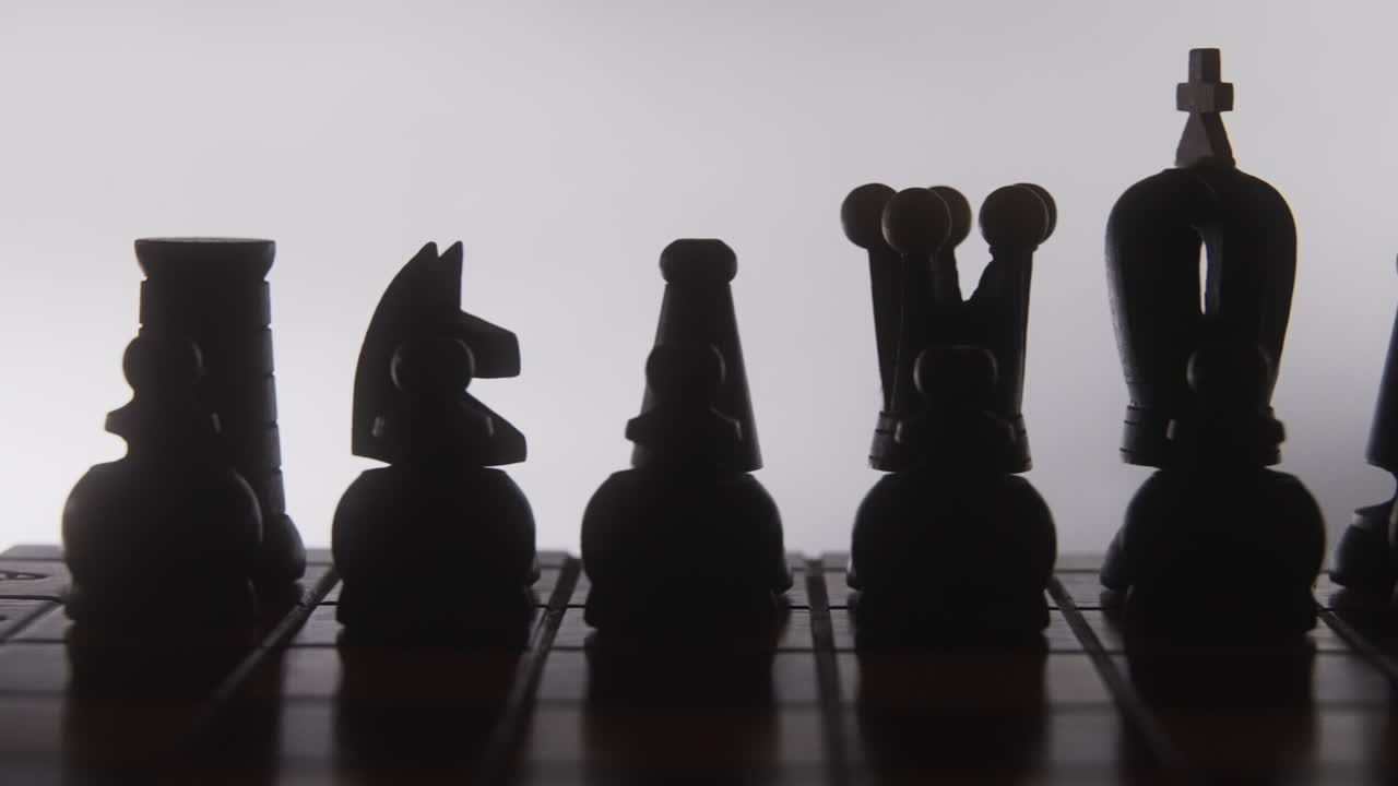 Chess Pieces in Silhouette on Board