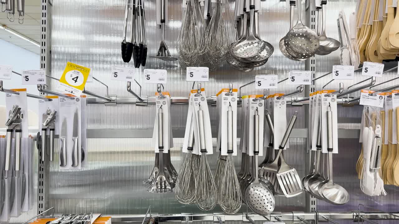 Various kitchen tools organized on store shelves