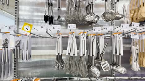 various kitchen tools organized on store shelves